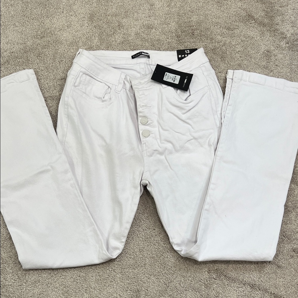 Brand new with tags. White flare jeans. Size 13.